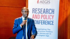 Aegis Country Director Alphonse Munyentwali speaks at Aegis research and policy conference in Kigali